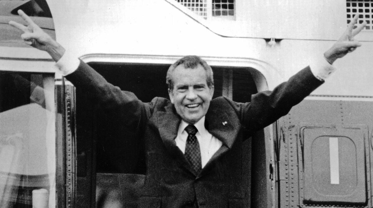 President Nixon's farewell on Aug. 9, 1974, as he boards a helicopter at the White House. (Associated Press)