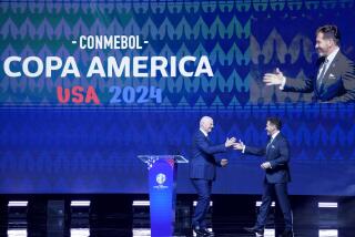 CONMEBOL President Alejandro Dominguez, right, greets FIFA President Gianni Infantino.