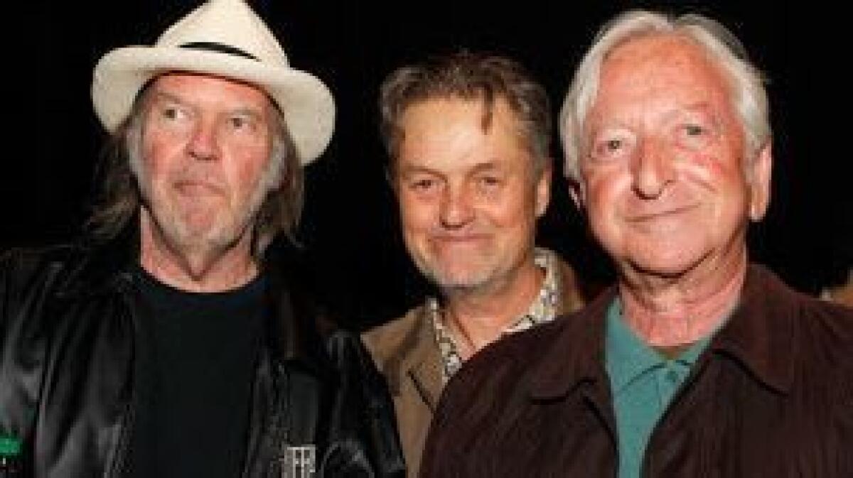 Neil Young, director Jonathan Demme and Elliot Roberts attend the premiere of a Demme-directed documentary on Young during the 2011 Toronto International Film Festival.