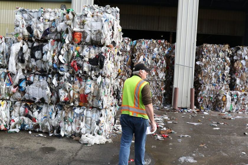 Sunrise Enterprises recycle manager Steven Buckley walks toward bundled materials waiting to be transported in Green, Oregon in January 2018. Douglas County, Oregon along with Sunrise Enterprises, will suspend all recycling efforts effective June 1, 2018. (Michael Sullivan /The News-Review via AP)