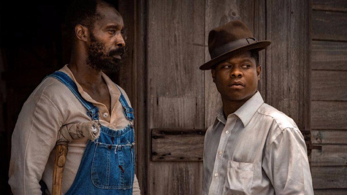 Rob Morgan, left, and Jason Mitchell in a scene from "Mudbound."