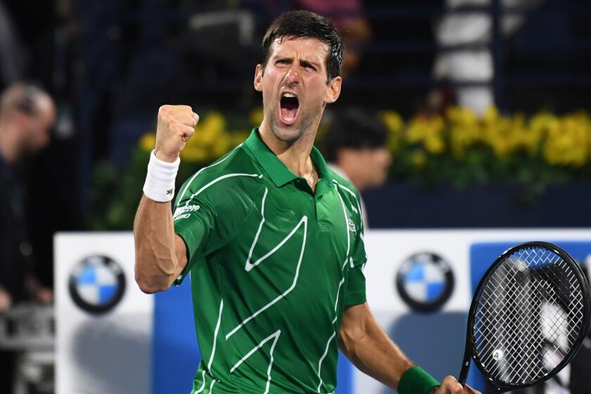 Novak Djokovic of Serbia celebrates after winning the final of the Dubai Duty Free Tennis Championship in the Gulf emirate of Dubai on February 29, 2020. (Photo by KARIM SAHIB / AFP) (Photo by KARIM SAHIB/AFP via Getty Images)