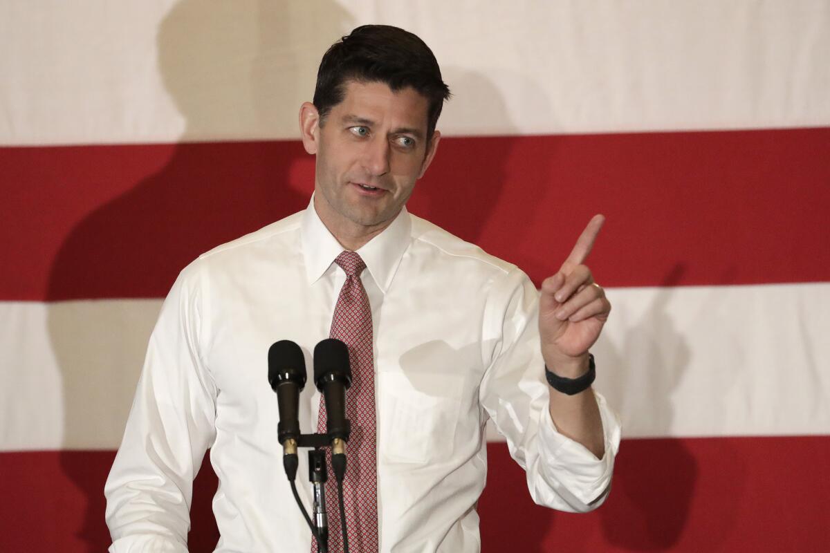 Paul D. Ryan, speaking at a 2018 event, holds up one index finger.