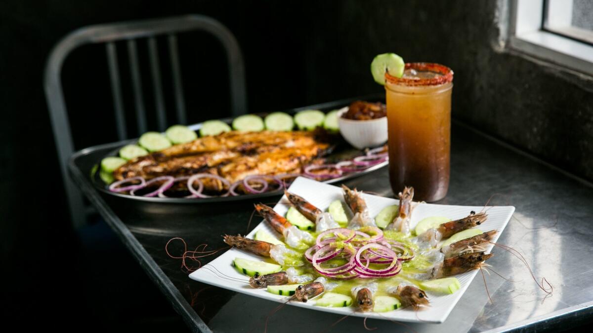 Aguachile, shrimp marinated with lemon, cucumber, tomato and onion, at Coni'Seafood.