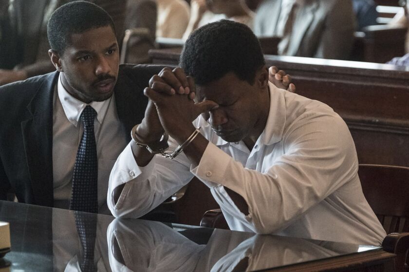***HOLIDAY 2019 SNEAKS***DO NOT USE BEFORE NOVEBER 3, 2019 .(L-r) MICHAEL B. JORDAN as Bryan Stevenson and JAMIE FOXX as Walter McMillian in Warner Bros. Pictures’ drama JUST MERCY, a Warner Bros. Pictures release. Photo by JAKE GILES NETTER