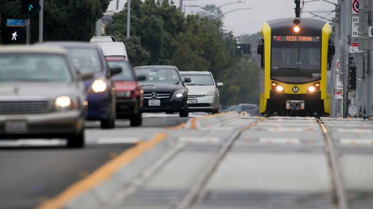 An Expo Line test train runs along Colorado Avenue in Santa Monica on Thursday.