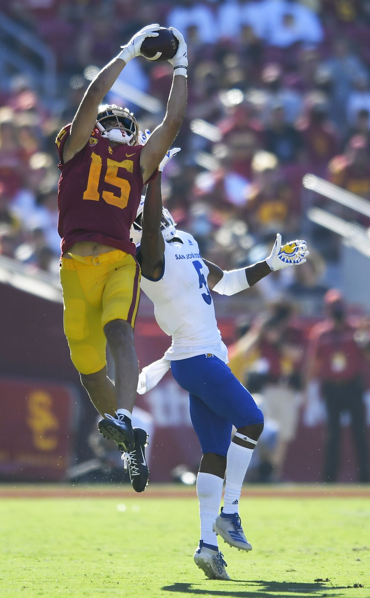 USC wide receiver Drake London catches the ball over San Jose State defensive back Bobby Brown II on Sept 4, 2021.