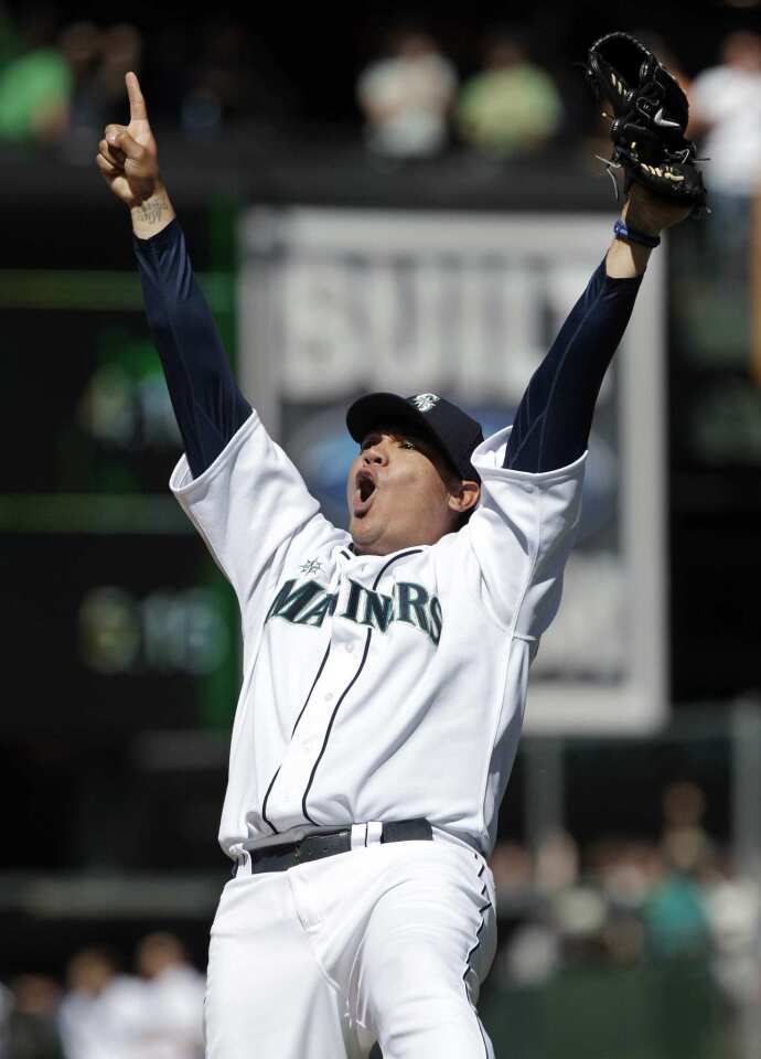 Mariners pitcher Felix Hernandez reacts after striking out Sean Rodriguez of Tampa Bay in the ninth inning to complete a perfect game against the Rays.