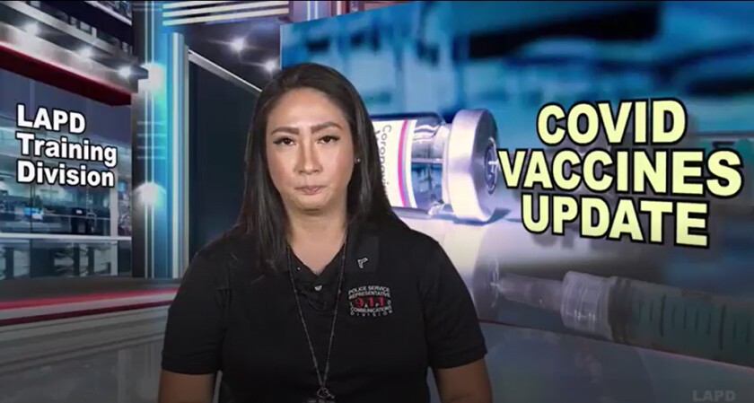 A woman in a video in front of graphics that say LAPD Training Division and COVID Vaccines Update