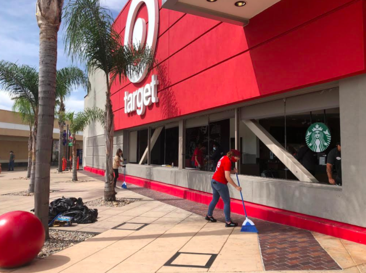 May 2020 photo of workers clean up outside a Target store in San Diego County. 