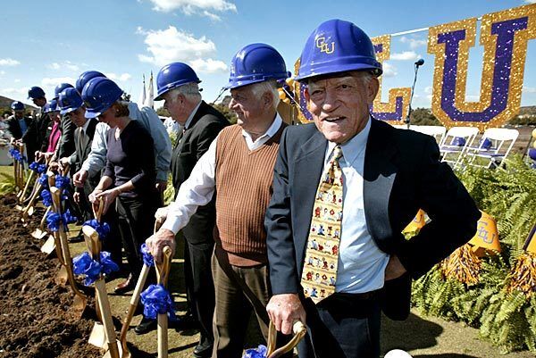 Anderson and Tommy Lasorda attend the ceremonial groundbreaking for a new baseball field at California Lutheran University in Thousand Oaks. The field was named in Anderson's honor. See full story