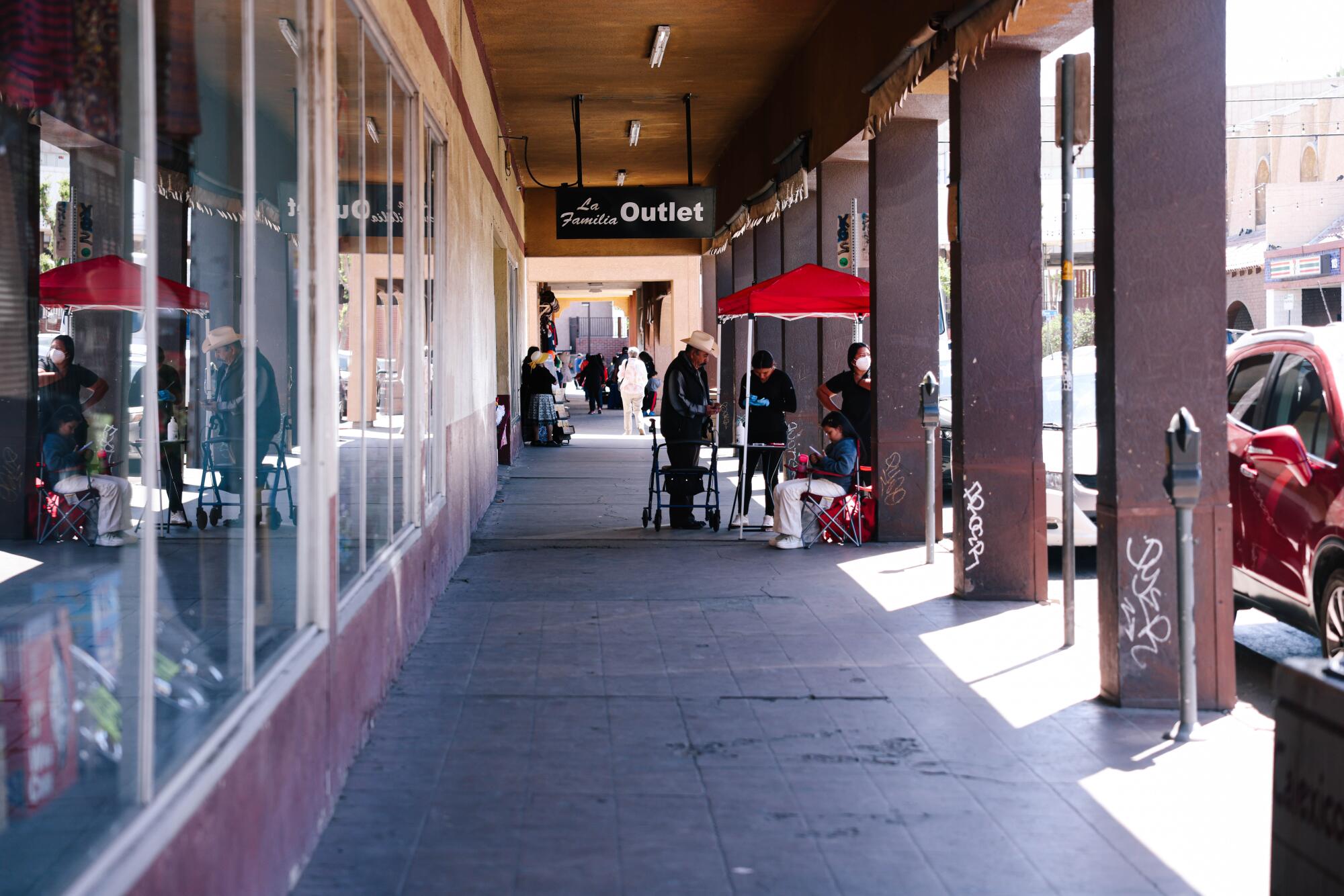 People visit a shopping arcade in Calexico, California