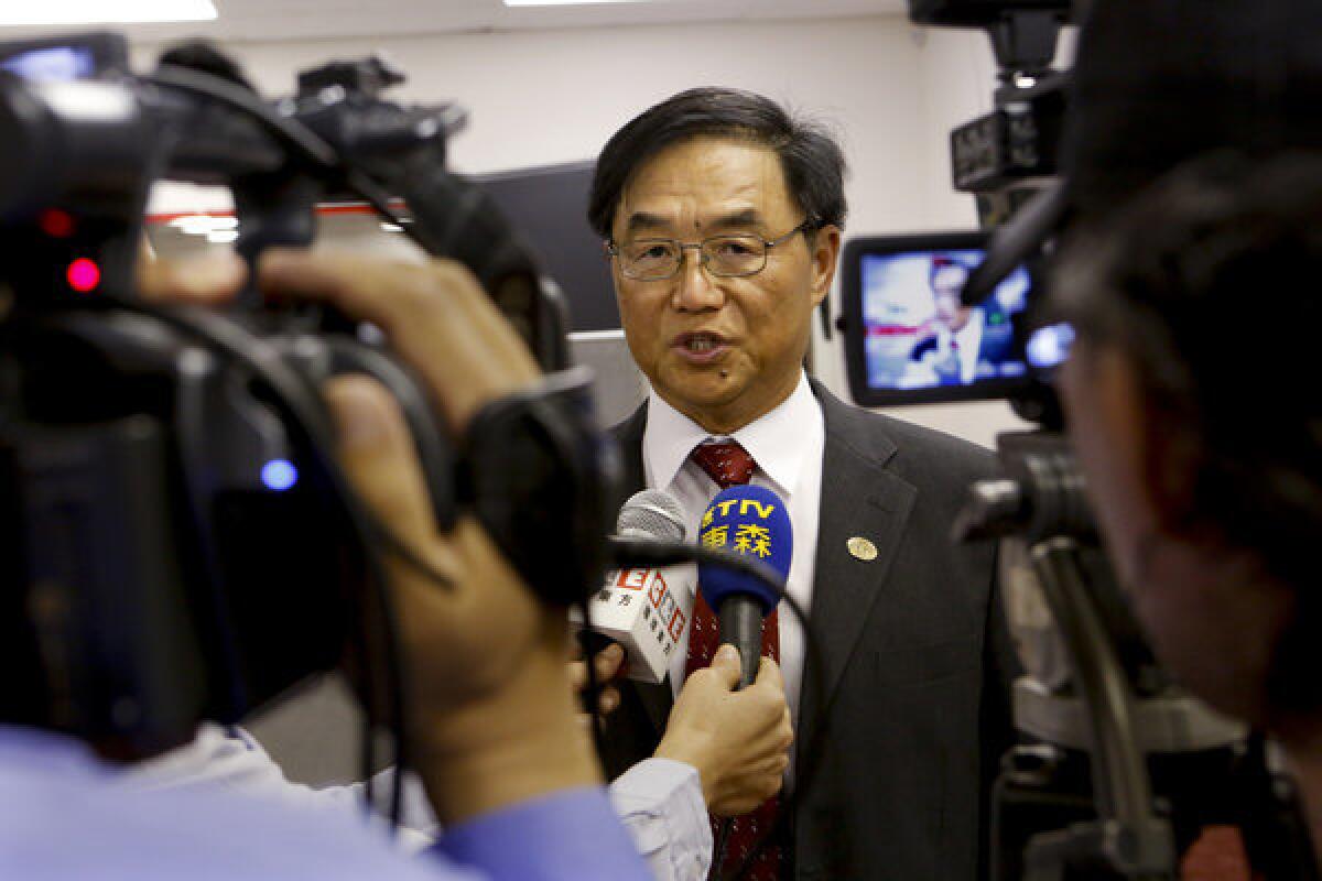 Hacienda La Puente school board member Joseph Chang answers questions at a news conference in September.