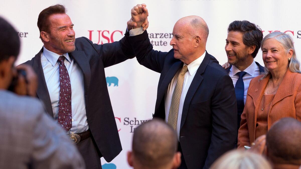 Former Gov. Arnold Schwarzenegger, left, a Republican, and Democratic Gov. Jerry Brown, shown last year, are both cap-and-trade proponents.