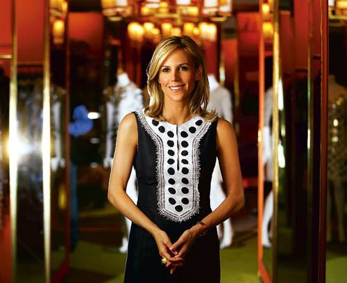 Tory Burch has become the most imitated American designer. Here, at her Robertson Boulevard boutique in Los Angeles, she wears a shift dress from her spring collection. More... • Tory Burch is a must-have lifestyle brand Also in Image • Tips for men on wearing short-sleeve, button-up shirts • Che: Man, myth, logo
