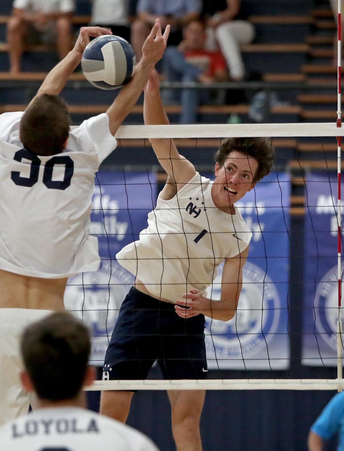 Newport Harbor's Brendan Read, right, battles against Los Angeles Loyola's Sean Kelly.