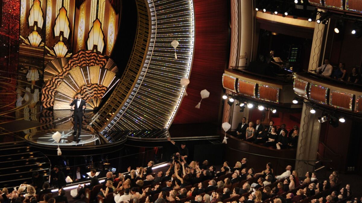 Jimmy Kimmel is shown hosting the 2018 Academy Awards broadcast, which saw the ratings drop by 20 percent compared with ratings for the 2017 show.