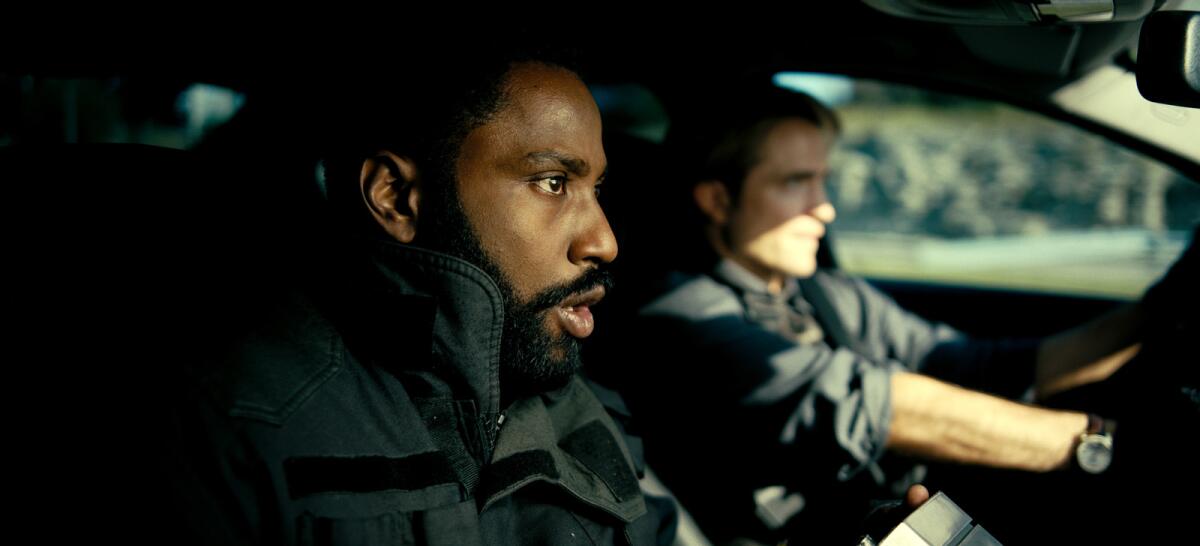 John David Washington, left, and Robert Pattinson in the movie "Tenet."