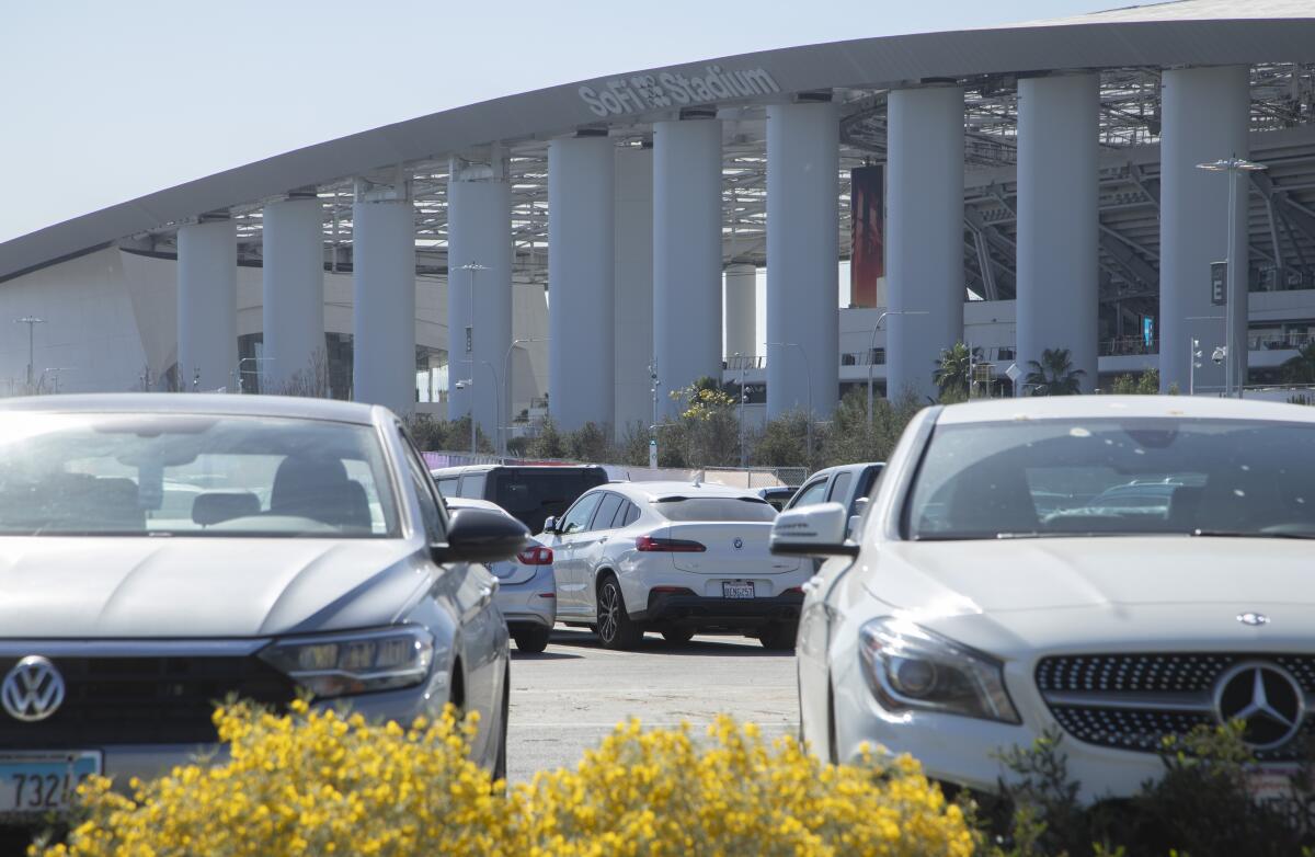 Cars fill the parking spaces in front of SoFi Stadium 