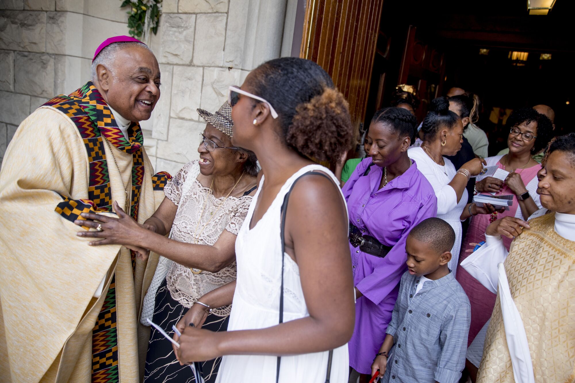 Archbishop Wilton Gregory greets parishioners at St. Augustine Catholic Church.