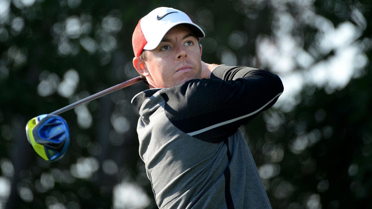 Rory McIlroy watches his tee shot at No. 17 during the first round of the HSBC Golf Championship.