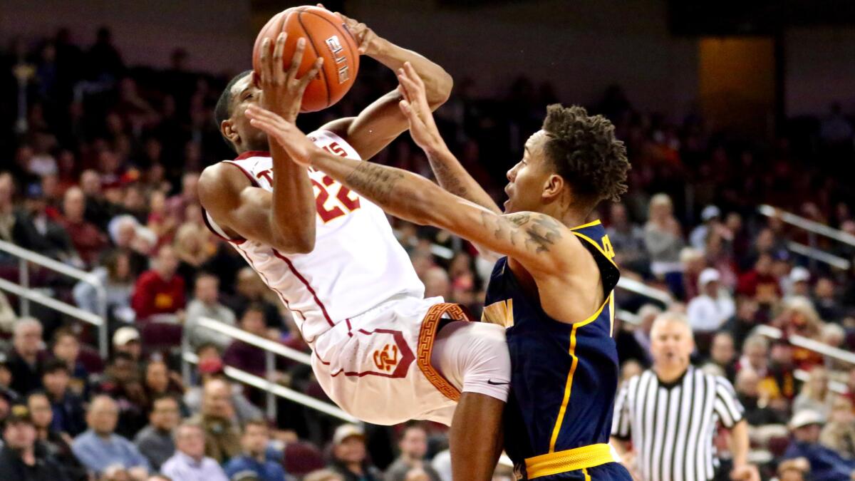 California guard Don Coleman tackles USC guard De'Anthony Melton during the first half. Coleman was assessed a flagrant-1 foul.