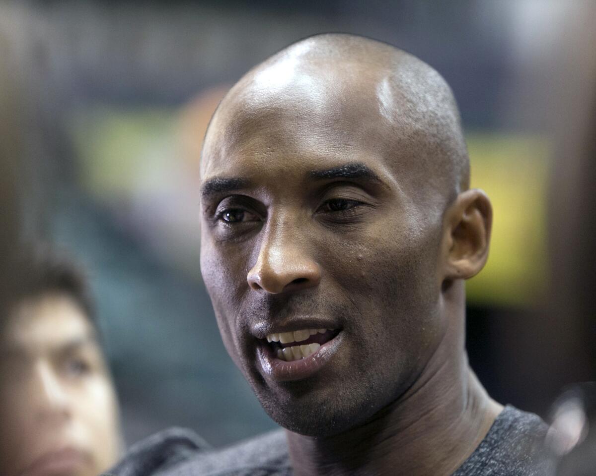 Lakers guard Kobe Bryant talks to the media after a team practice at the Stan Sheriff Center on Tuesday in Honolulu.