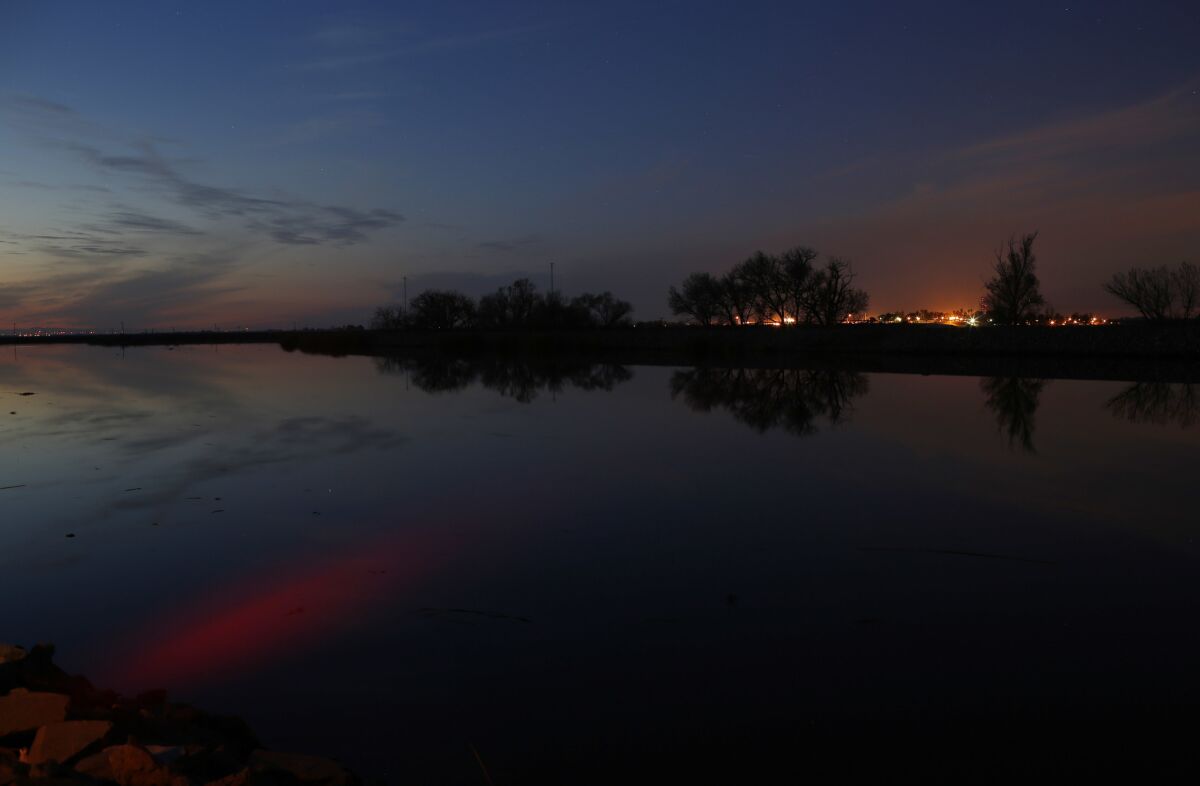 The sun sets over Middle River in the Sacramento-San Joaquin River Delta, the hub of California’s water works.