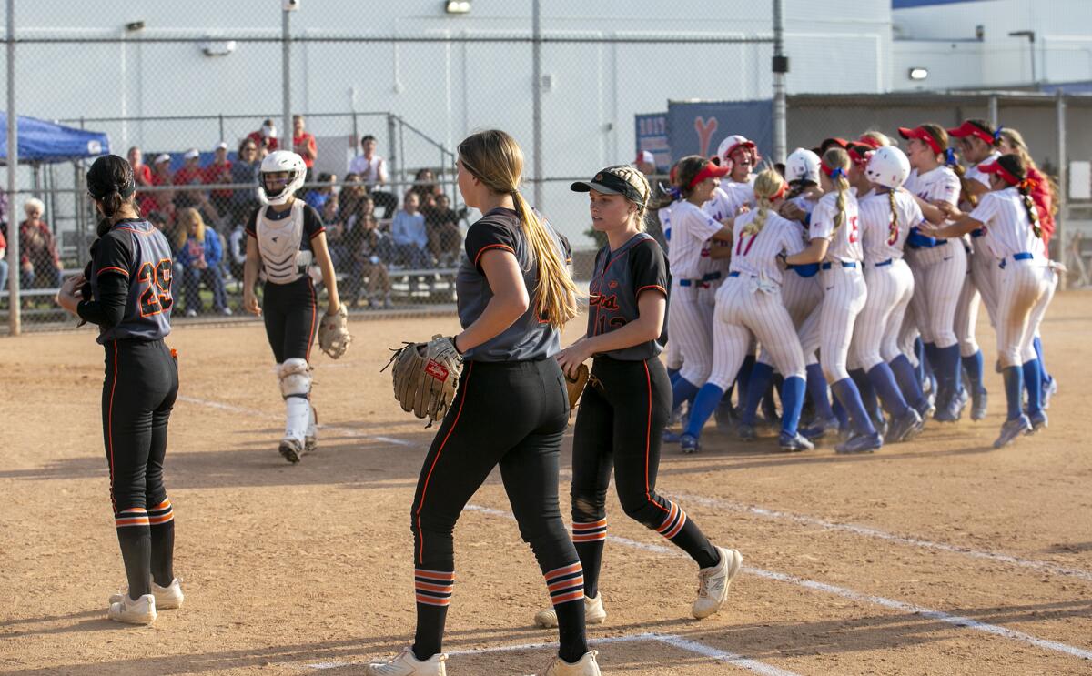 Los Alamitos celebrates after beating Huntington Beach in a Sunset League game on Monday.