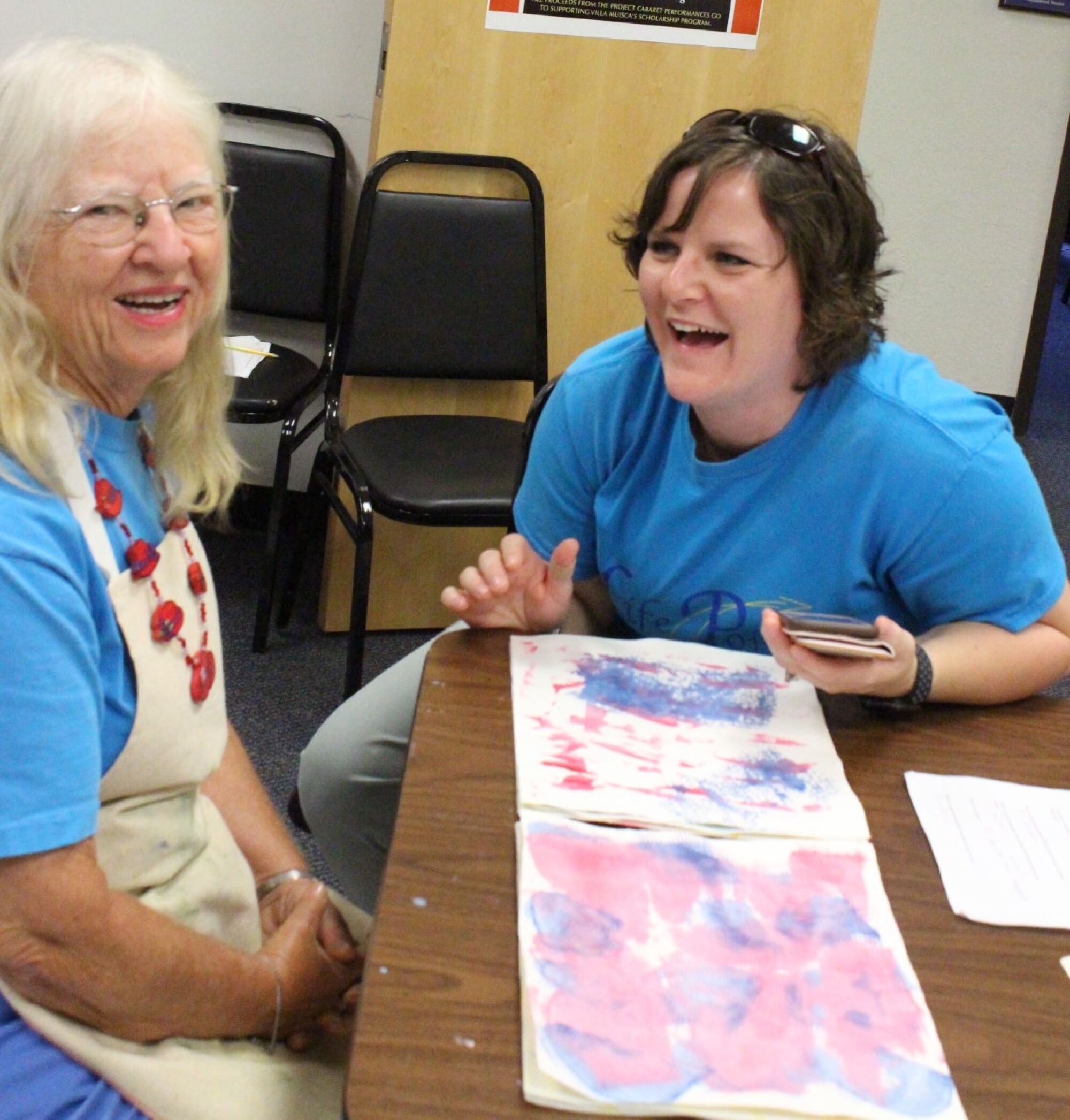 Musical biography student Sherry (whose last name is witheld to protect her privacy) works with music therapist Audra Munoz on a scrapbook during a class at Villa Musica.