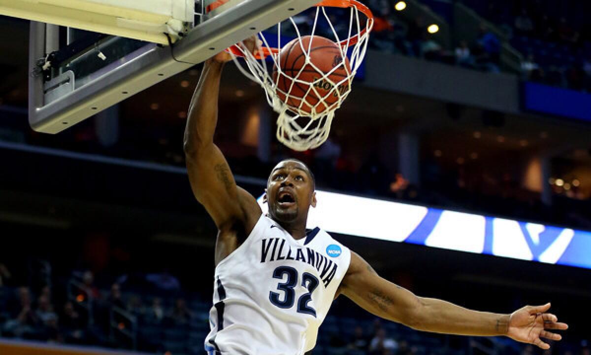 Villanova's James Bell dunks during the Wildcats' 73-53 victory over Milwaukee in the second round of the NCAA tournament on Thursday.