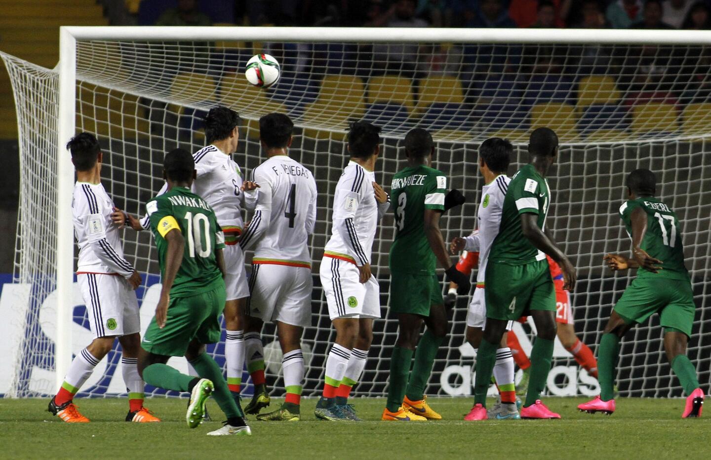 Nigeria's player Kelechi Nwakali (2nd L) scores against Mexico during the FIFA U-17 World Cup Chile 2015 semifinal football match, at Ester Roa Rebolledo stadium in Concepción, Chile, on November 5, 2015. AFP PHOTO / PHOTOSPORT - DRAGOMIR YANKOVICDRAGOMIR YANKOVIC/AFP/Getty Images ** OUTS - ELSENT, FPG, CM - OUTS * NM, PH, VA if sourced by CT, LA or MoD **