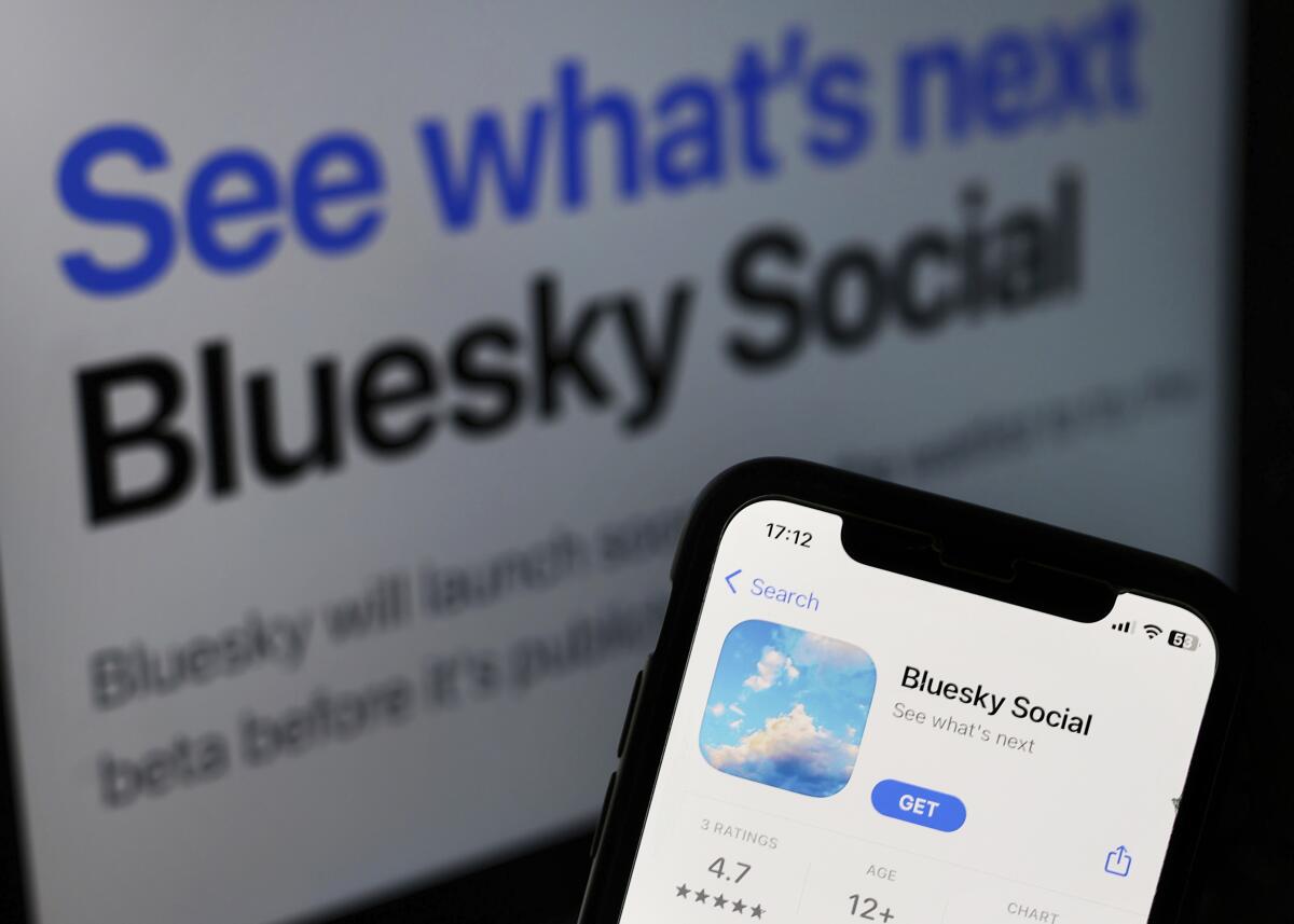 Bluesky Social on App Store displayed on a phone screen and Bluesky Social website displayed on a laptop screen