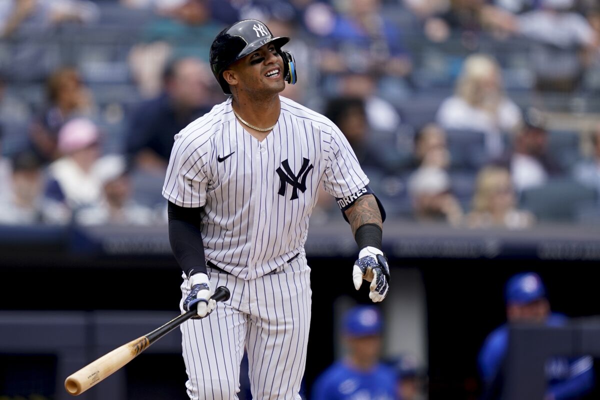 CORRECTS PLAYERS NAME TO GLEYBER TORRES AND NOT CHARLIE MONTOYA AS ORIGINALLY SENT - New York Yankees' Gleyber Torres hits a three-run home run off Toronto Blue Jays starting pitcher Jose Berrios (17) in the fourth inning of a baseball game, Wednesday, May 11, 2022, in New York. (AP Photo/John Minchillo)