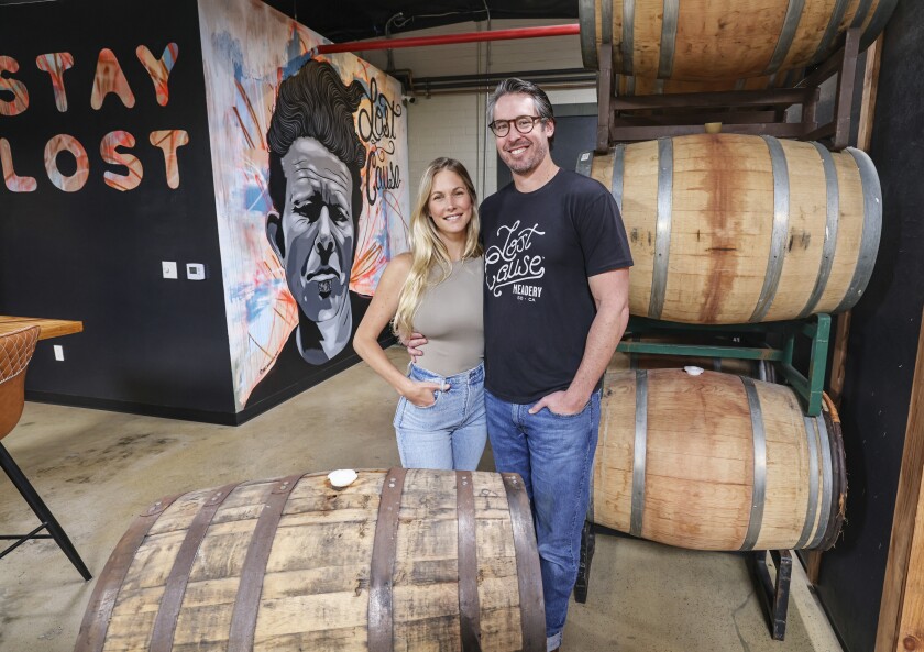 Lost Cause Meadery owners Suzanne Betz and Billy Betz inside the barrel room of their San Diego business on March 9.