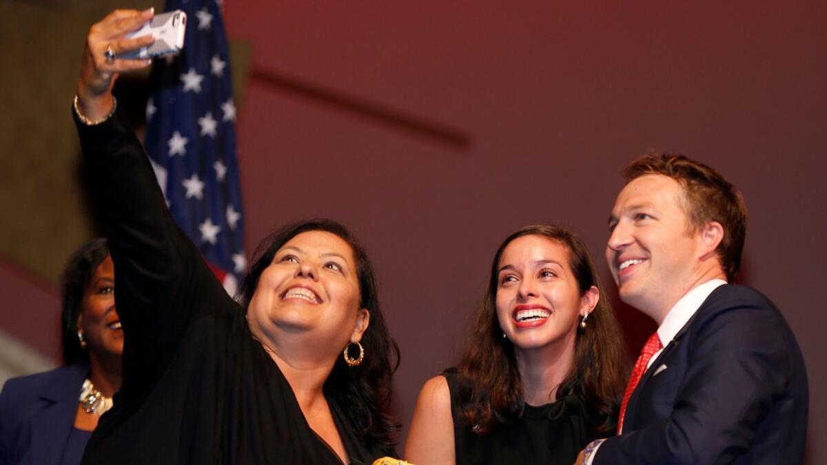 Los Angeles Unified board members Monica Garcia, left, Kelly Gonez and Nick Melvoin pose for a selfie together in July. Any of them could become the next board president but Garcia appears to have the inside track based on experience.