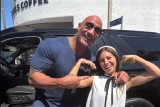 Actor Dwayne Johnson stopped his SUV on an L.A. street to buy lollipops for charity from Ever Matson, 13, of Del Mar.