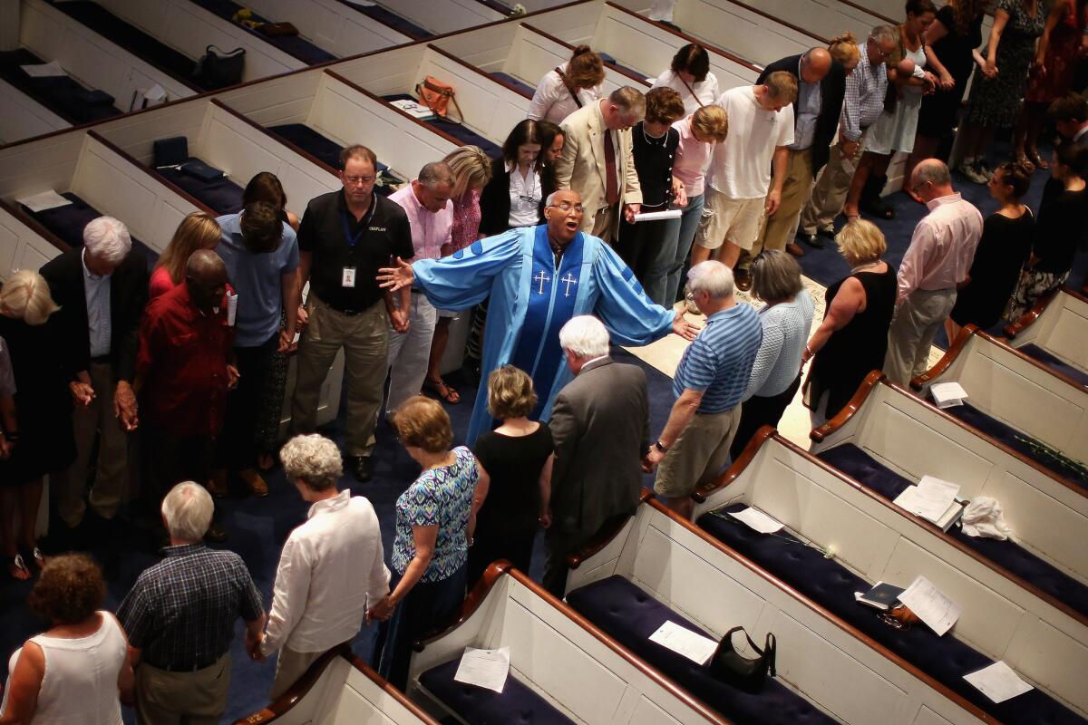 The Rev. Sidney Davis leads a prayer service at Second Presbyterian Church in Charleston, S.C., for the nine victims of Wednesday night's shooting.