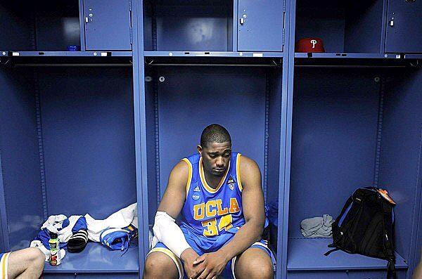 Former UCLA center Joshua Smith sits in the locker room after the Bruins' 73-65 loss to Florida in an NCAA tournament third-round game on March 19, 2011 at St. Pete Times Forum in Tampa, Fla.
