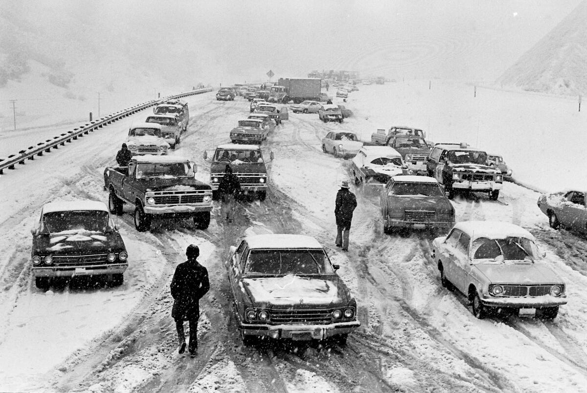 A 1974 black-and-white photo of stalled traffic amid snow on I-5 near Newhall 