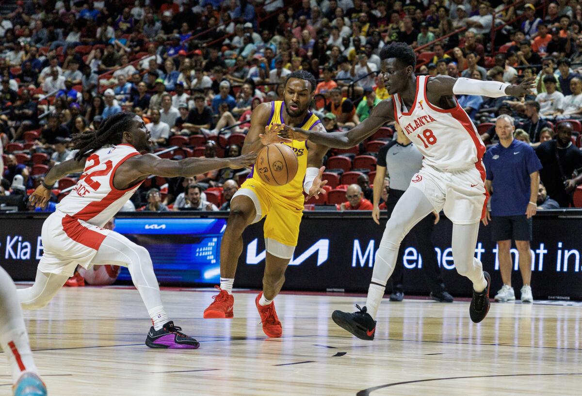 Bronny James drives through the Hawks defense during the first half Wednesday.