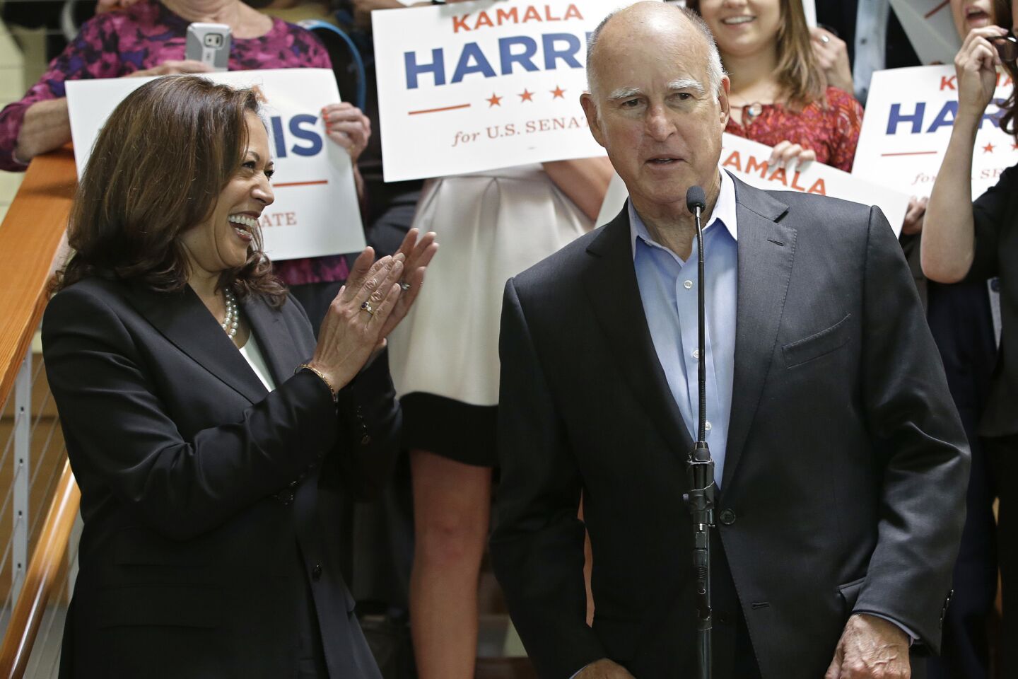 State Atty. Gen. Kamala Harris smiles and claps as Gov. Jerry Brown endorses her for the U.S. Senate.