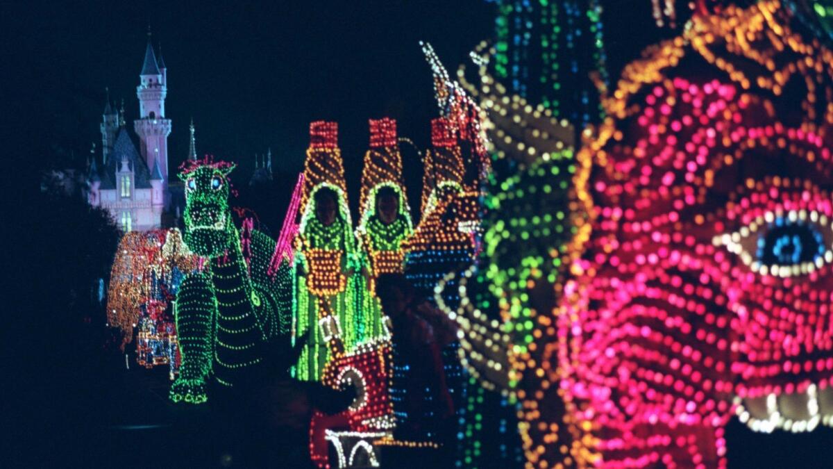 In this 1996 photo, the Main Street Electrical Parade travels down its eponymous road in Disneyland. Disney says the parade will return to Disneyland from Jan. 20 through June 18.