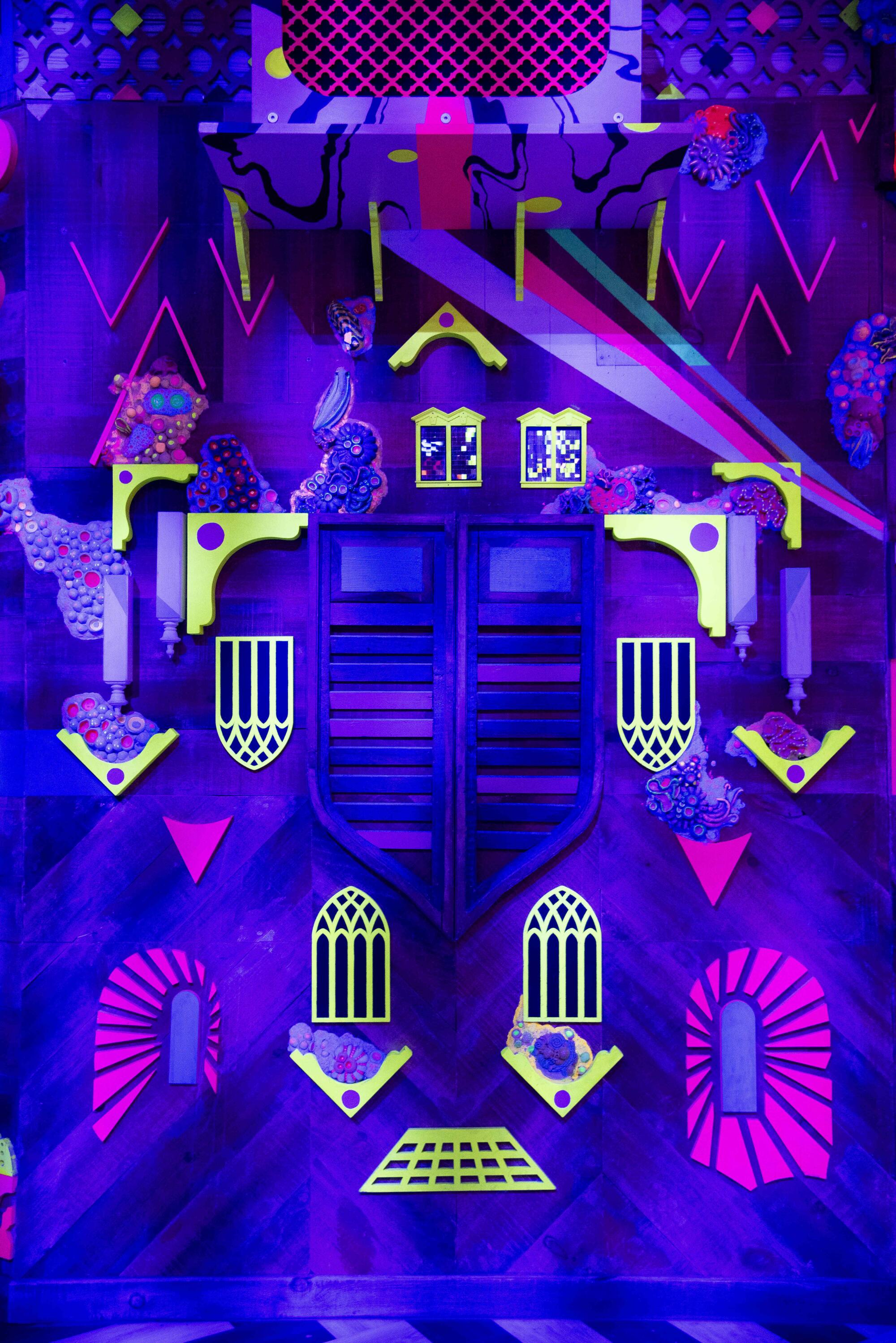 An area of Meow Wolf's Grapevine, Texas, exhibit is fashioned as a neon city. 