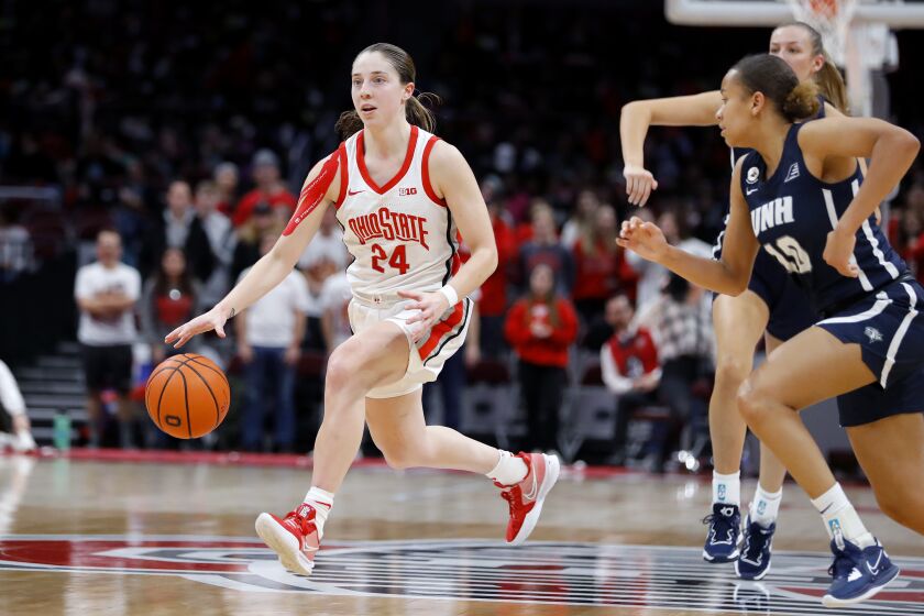 Ohio State guard Taylor Mikesell (24) dribbles up court before taking the three point shot at the end of the third quarter against New Hampshire as part of an NCAA college basketball game in Columbus, Ohio, on Thursday, Dec. 8, 2022. (AP Photo/Joe Maiorana)