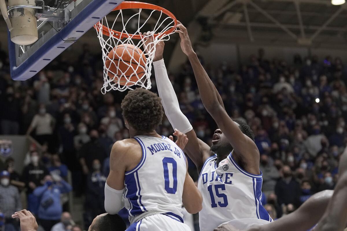 Duke center Mark Williams (15) dunks to take the lead late in the second half of an NCAA college basketball game against Wake Forest in Durham, N.C., Tuesday, Feb. 15, 2022. (AP Photo/Gerry Broome)