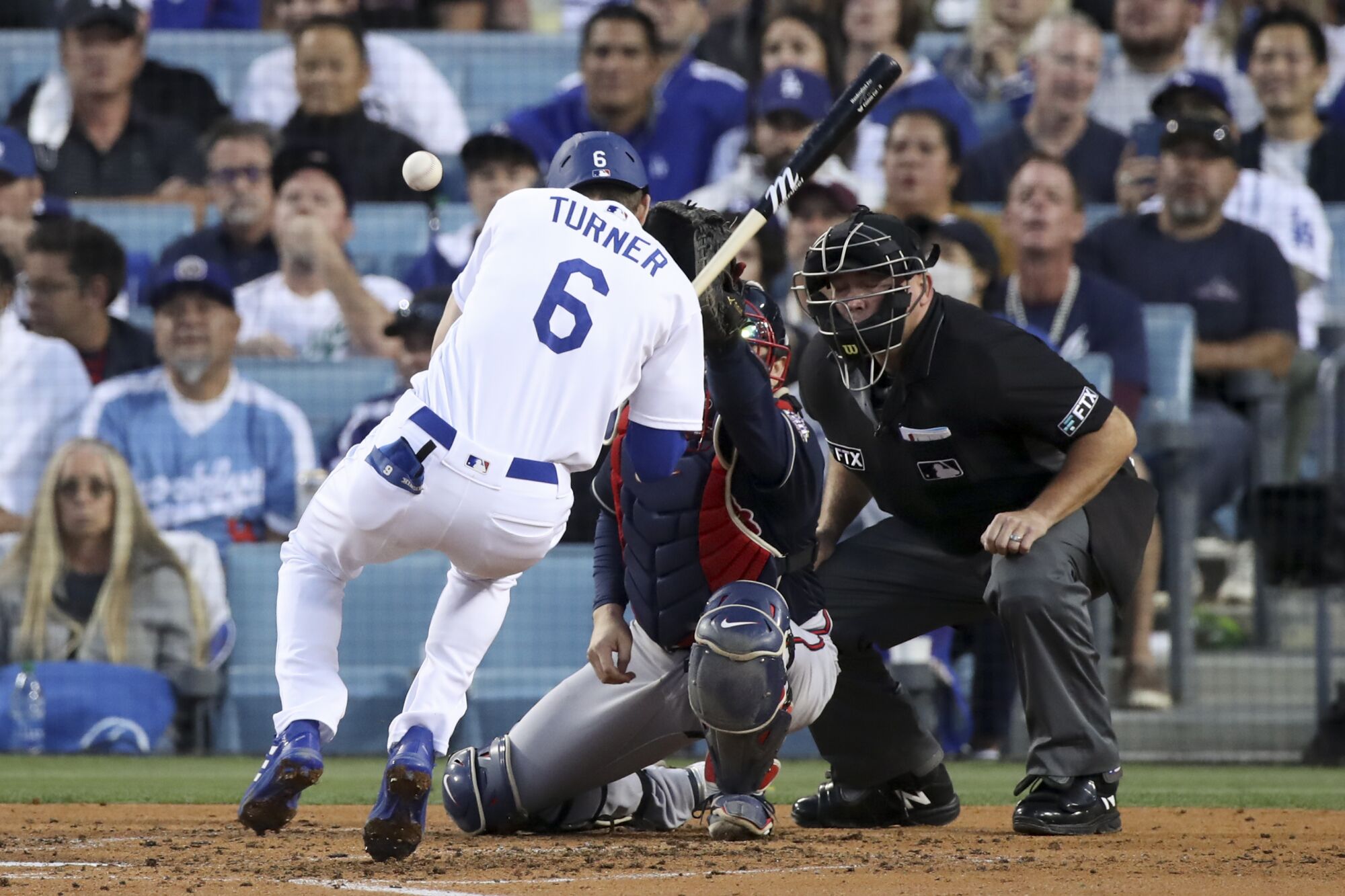 Dodgers' Trea Turner gets hit by a pitch.