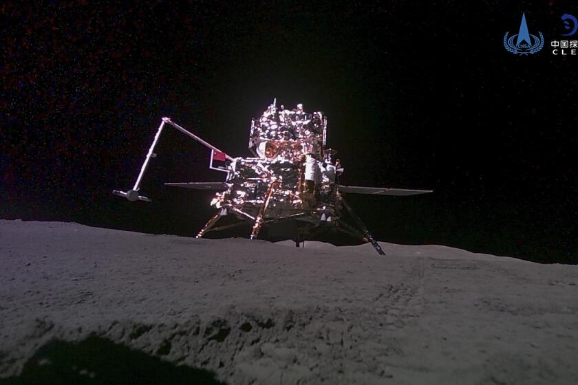 FILE -This China National Space Administration (CNSA) handout image released by Xinhua News Agency, shows the lander-ascender combination of Chang'e-6 probe taken by a mini rover after it landed on the moon surface, June 4, 2024. China's Chang'e 6 probe returned on Earth on Tuesday with rock and soil samples from the little-explored far side of the moon in a global first. The probe landed in northern China on Tuesday afternoon in the Inner Mongolian region. (CNSA/Xinhua via AP, File)
