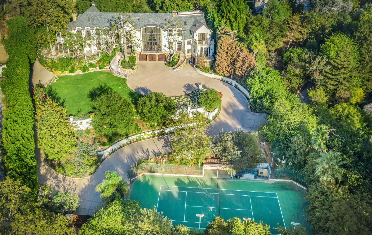 Gene Simmons' compound includes a 16,000-square-foot mansion, a tennis court and ample parking.