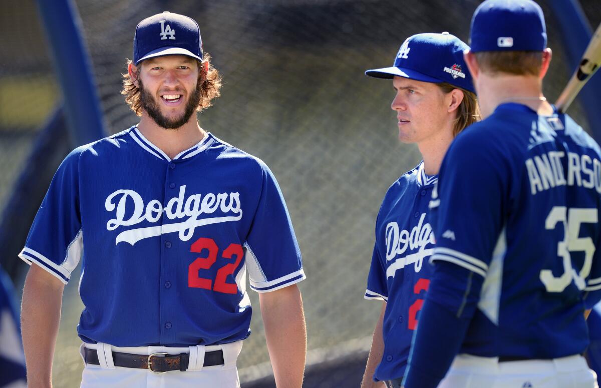 Dodgers pitchers Clayton Kershaw, Zack Greinke and Brett Anderson talks during a practice at Dodger Stadium on Wednesday ahead of Friday's NLDS opener against the New York Mets.